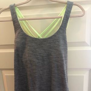 Lululemon tank with loose drape in back.